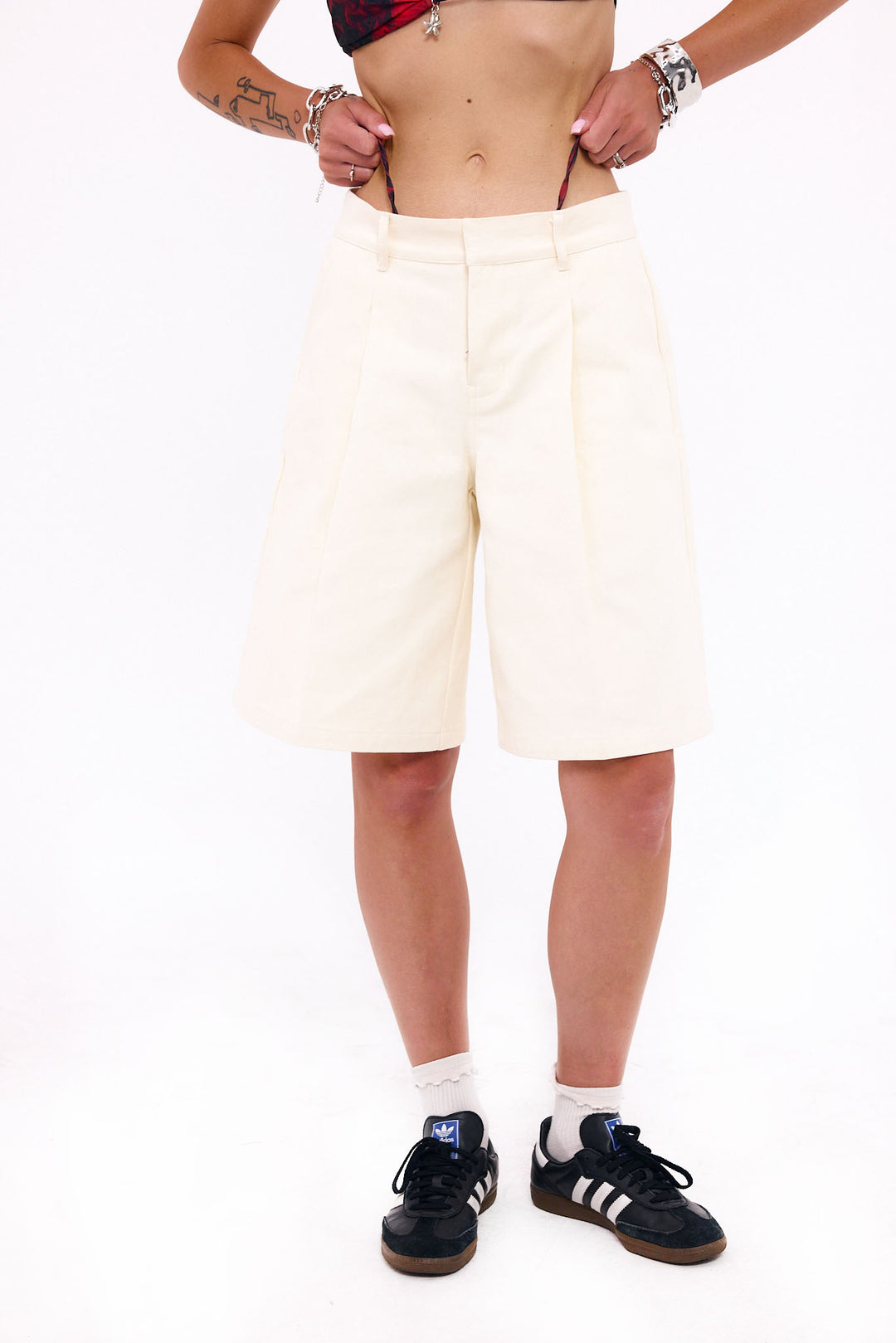 Loud Minds Good Riddance Shorts in beige heavyweight cotton, low-waisted bermuda, styled on model