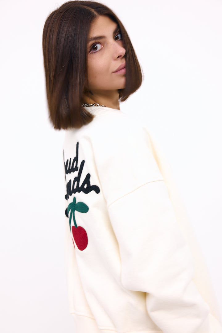 Loud Minds The Iconic Fleece Cardigan in white organic cotton fleece, button-up, styled on model