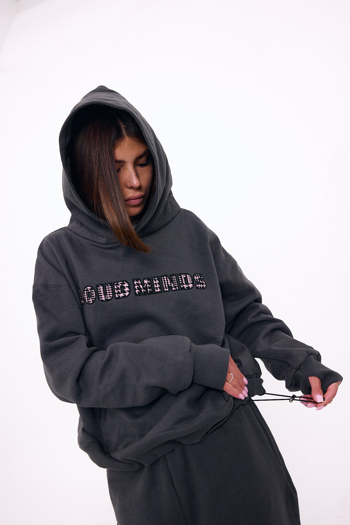 Loud Minds Your Favorite Fleece Hoodie in charcoal organic cotton fleece, styled on model