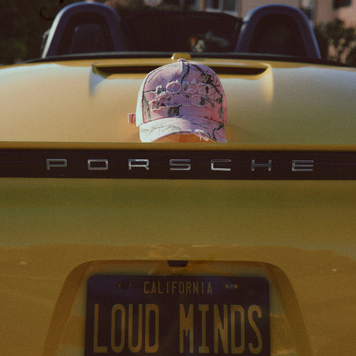 Yellow Porsche car with a cap on the trunk and &