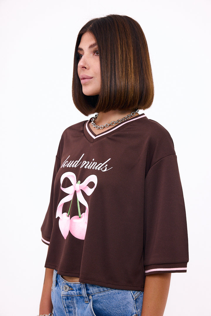 Loud Minds The Juicy Jersey in cropped brown sports mesh with cherry and bow graphic, back view
