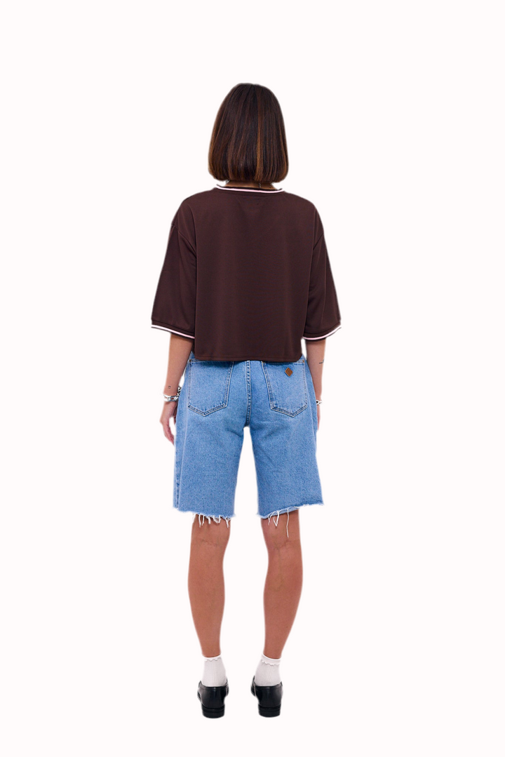 Loud Minds The Juicy Jersey in cropped brown sports mesh with cherry and bow graphic, fabric detail
